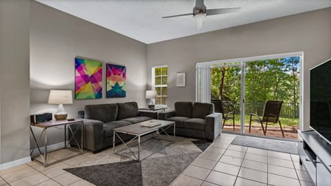 Beautiful Downstairs Living Room with Flat Screen TV and Patio