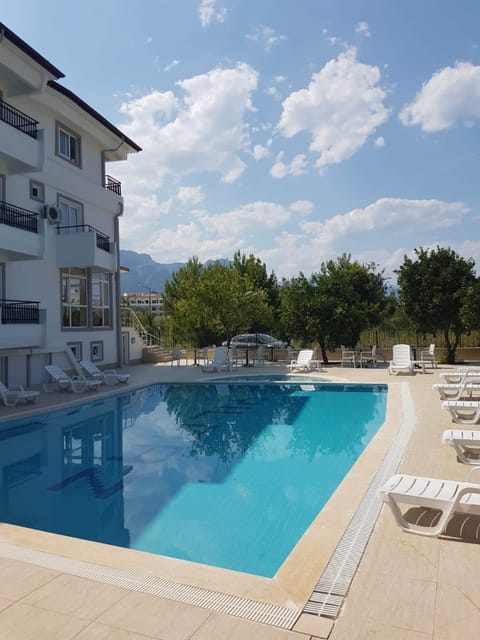 Seasonal outdoor pool, open 9:00 AM to 9:00 PM, pool umbrellas
