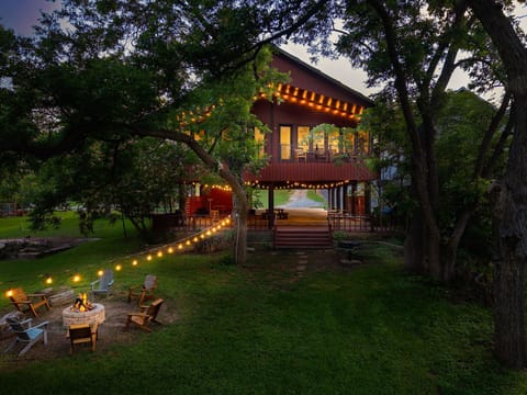 Evening glow at your lakeside retreat. Fire pit ready for memorable nights.