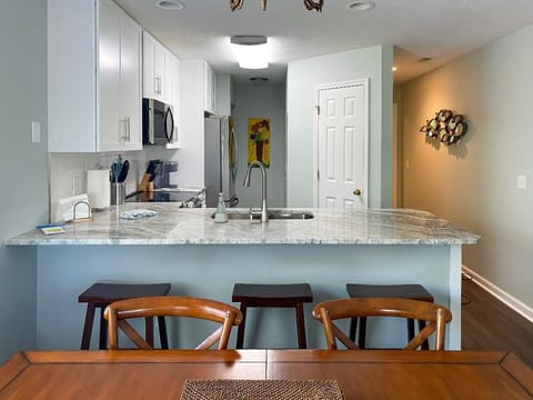 BRAND NEW renovated kitchen with stainless steel appliances & marble countertops