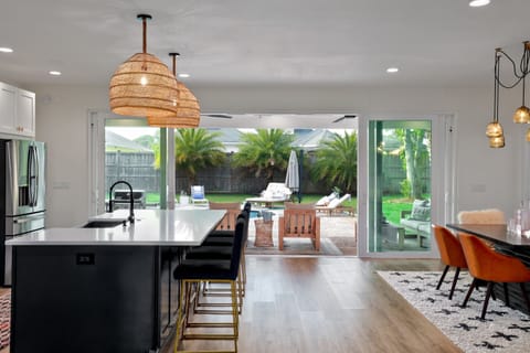 Open kitchen and dining area with pool views