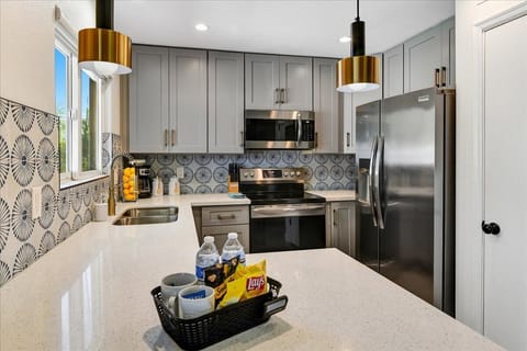 Open kitchen concept with full size appliances and kitchen fully stocked