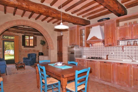 The main living-dinner room with the kitchen in the bigger unit