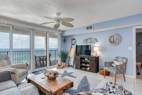 Open-concept living room with Gulf views and comfortable seating at Wind Drift Orange Beach
