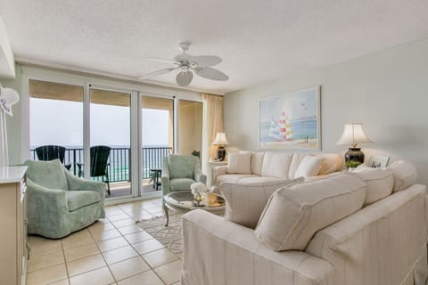 Top-floor living room with Gulf-front views and white coastal décor at Wind Drift Orange Beach