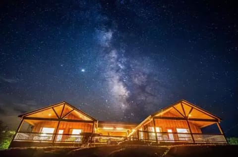 Cabins C + D @ night under the Milky Way! Area voted for the best stargazing! 
