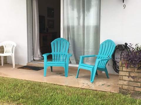 Downstairs patio with views of the ocean and the pool.
