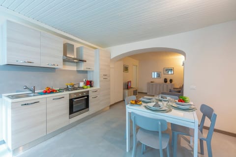Family Apartment, 1 Bedroom (Nonna Sandrina in Monferrato hills) | Private kitchen | Stovetop, dining tables
