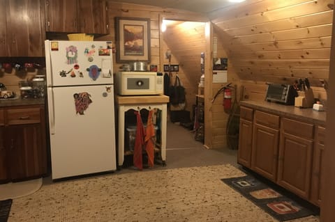 View from kitchen into back hall, bathroom and sun porch area