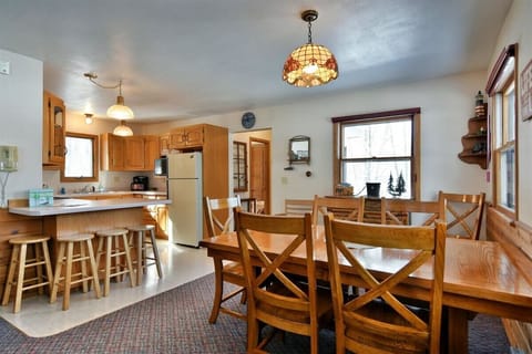 Dining area use the table for a sit down dinner or slide up to the snack bar