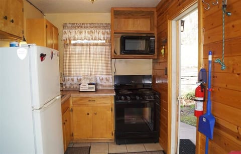 Kitchen has full size appliances.