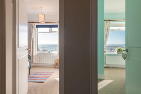 White Cottage Split View of Bedrooms