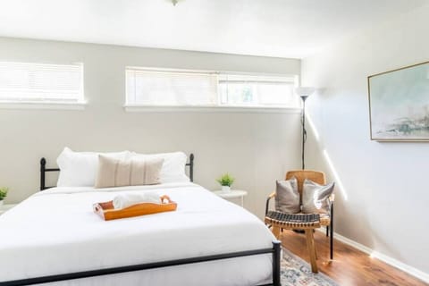 Wake up refreshed in this calm, sunlit queen bedroom.