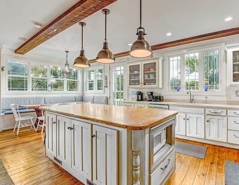 Chef's kitchen with large island keeps things tidy in the kitchen.