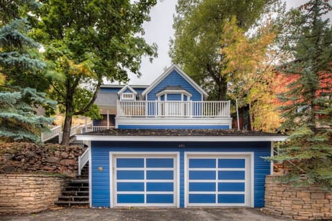 Outside view of home - 2 car garage & balcony
