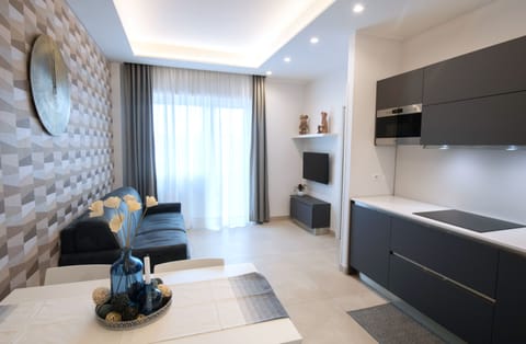 Apartment, 1 Bedroom, Balcony | Living area | Flat-screen TV