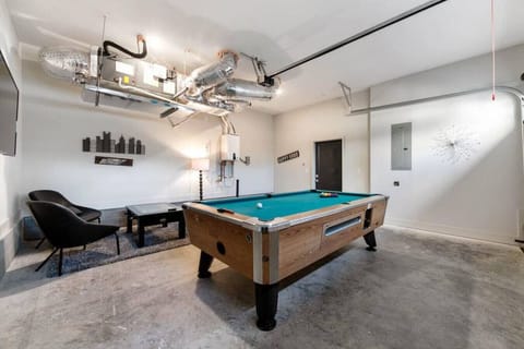Enjoy the converted garage with a game of pool, some TV, or Foosball!