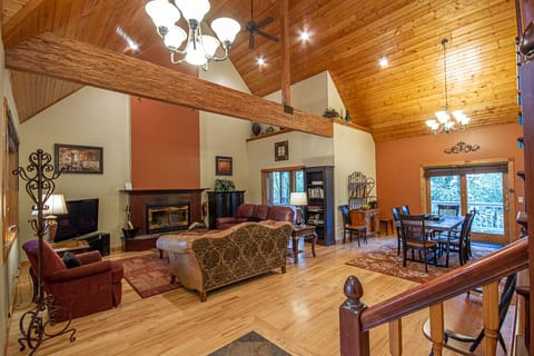 Grand living room with wood-burning fireplace