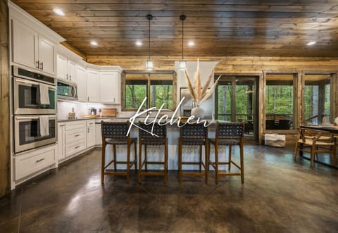 Whip up delicious memories in this chic, fully-equipped kitchen. Savor your morning coffee with nature as your audience through the grand windows.