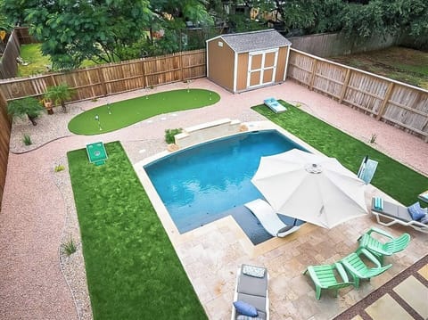 Large backyard with games and pool