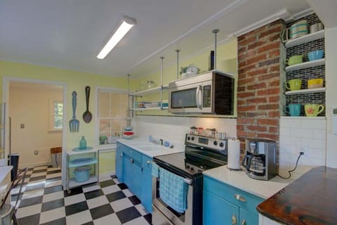 The kitchen is open to the living room and has bar seating along the front.