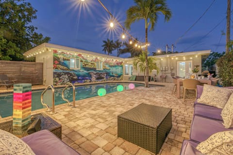 Spacious fenced-in back yard Oasis, heated pool, BBQ Grill, dining table for 10, lounge chairs, and patio table for lounging and entertaining. 