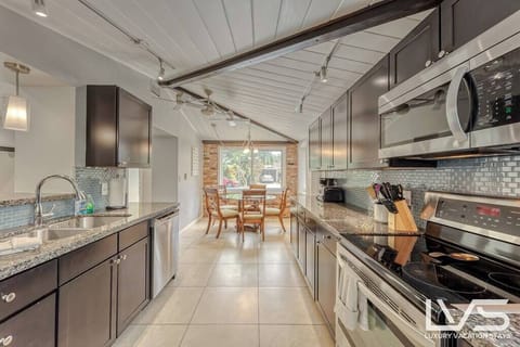 MAIN HOUSE KITCHEN #1- Dining Table/Breakfast Nook for 6.  There is also another dining table in the dining room.  Fully Appointed Updated Kitchen with Stainless Steal Appliances (Microwave, Refrigerator, Ceramic Cooktop & Oven, Dishwasher, Toaster, Regular Drip Coffee Maker & Fully Stocked with Pots/Pans, Baking Pans, Dishware, Silverware & Glassware.