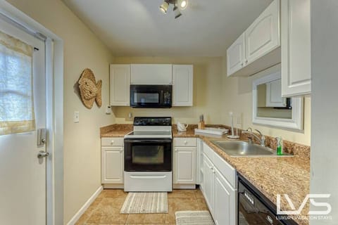 ATTACHED EFFICIENCY- 2nd Full Kitchen inside Attached Separate Living Quarter
Efficiency Layout-
1 Bedroom/ Full Bathroom/ Full Kitchen & Living Room.  Property has 2 Full Size Kitchens. 
SMART TV
DINING for 4 
Separate Entrance 
Also exits to Pool Area & Backyard