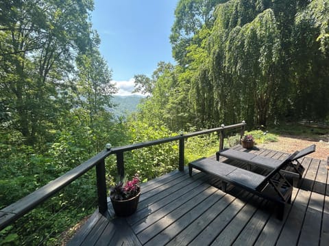 Relax on the spacious sun deck at Edgeview Chalet in Bryson City with sweeping Smoky Mountain views.