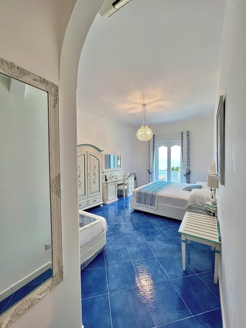 Family Triple Room, Balcony | 1 bedroom, down comforters, in-room safe, blackout drapes