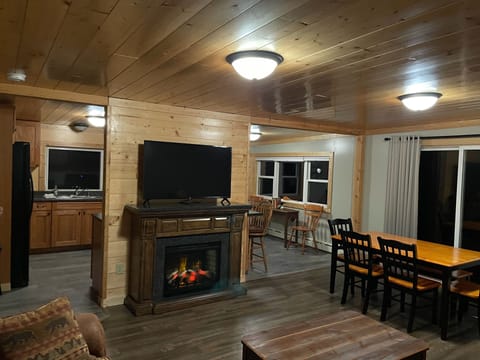 Living room, looking toward kitchen, electric heating fireplace