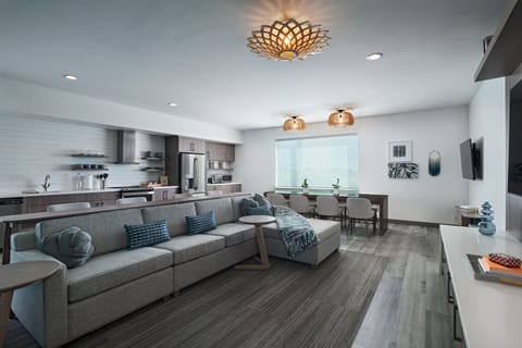 Suite, 4 Bedrooms, Courtyard View | Living room | 55-inch LED TV with digital channels