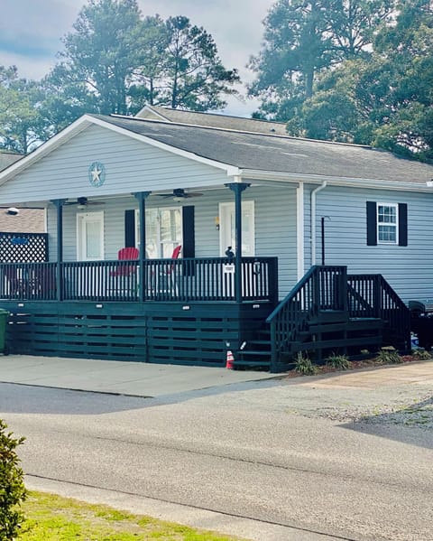 Front of House. (4-Seater Golf cart is available to rent with this property).