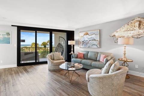 Living Room with comfortable seating and balcony access.

Professionally Managed by
Breathe Easy Rentals