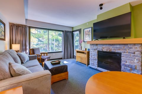 Living room with Fireplace and Flat screen smart TV with Cable