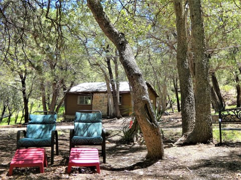 Seating area nest to the cabin by the creek.  Elf Owls cab be seen here.