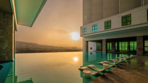 Outdoor pool, open 7:00 AM to 10:00 PM, pool umbrellas, sun loungers