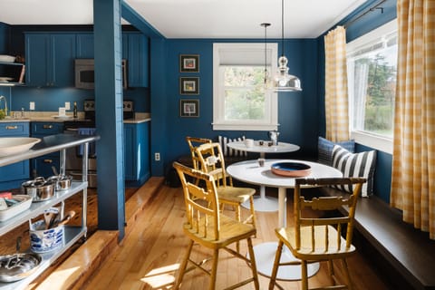 Eat-in kitchen sits ten people. Fully stocked with everything you need to cook. 