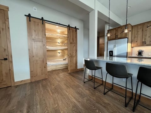 View of bunk room from dining area. Perfect for kids or a 3rd adult couple