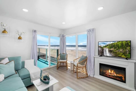 Living area w/ electric indoor fireplace heater and smart tv w/ app streaming only. 