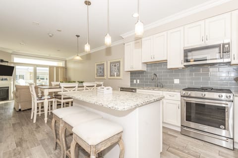 Beautiful Kitchen, dining and living area with walkout balcony with bay views