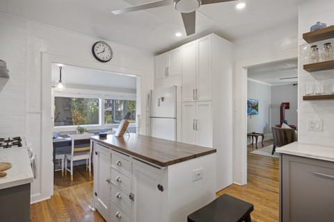 Kitchen island, cabinets, entryway