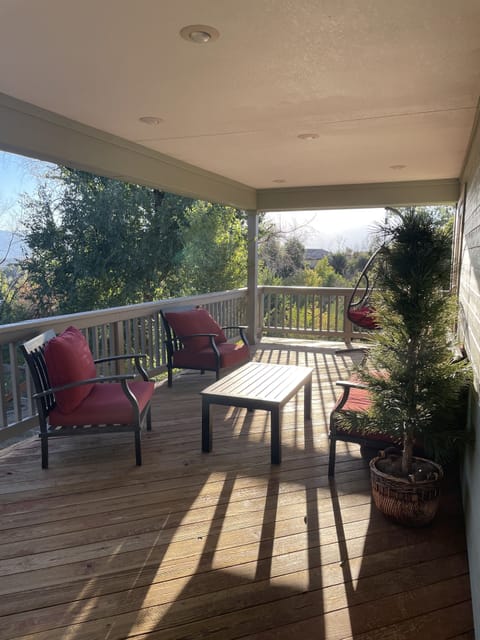 Covered porch with Pikes Peak Mountain views off the master