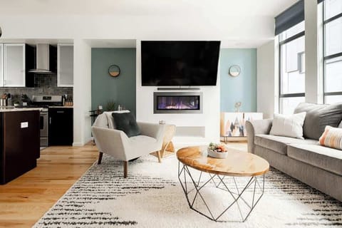 Cozy up by the fireplace in the living room