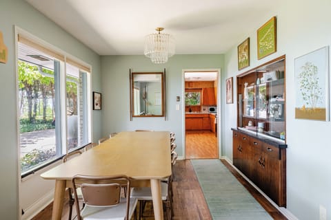 Huge wall of windows overlook backyard and Lake Michigan.