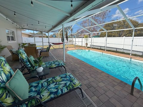 Comfortable seating around the heated pool, and a hammock! - Comfortable seating around the heated pool, and a hammock!