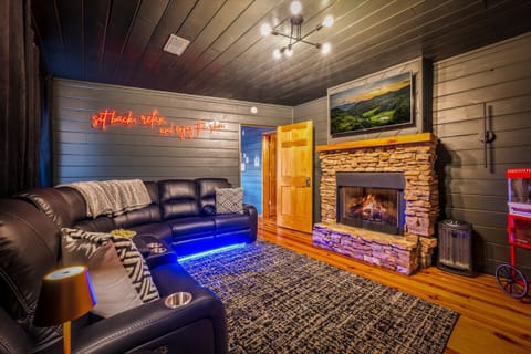 Gather for movie marathons in the Sevierville cabin living room, where the stone fireplace and plush leather seating create the best spot to recap your day at Dollywood.