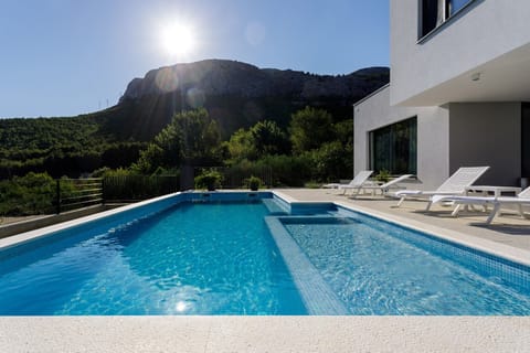 The neighborhood is unspoiled and private with amazing views of the town Split (10km) and hills covered with pine trees. 