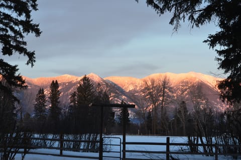 Alpen Glow on the Swan Mountains as seen from the front yard.