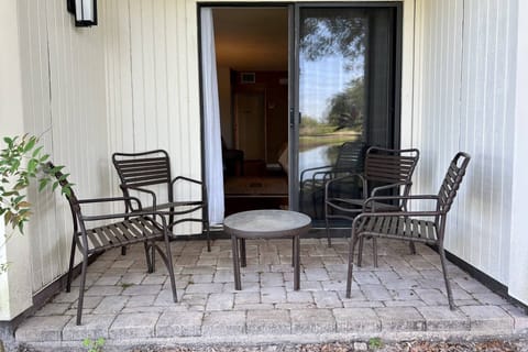 Private patio with seating for 4 beside the water!